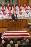 The Rev. Dr. Kirk H. Neely gets a laugh while telling a Bruce Littlejohn story during retired Chief Justice Bruce Littlejohn's funeral  at Morningside Baptist Church in Spartanburg, S.C., Tuesday afternoon April 24, 2007. Littlejohn was 93 and died Saturday.(AP Photo/Spartanburg Herald Journal/Gerry Pate)