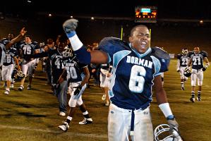 After scoring the winning touchdown, #6 Lamont Cartledge of Dorman, celebrates on the field with teammates.