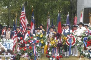 An honor guard watches on as wreaths are placed at a monument during the celebration of the 225th anniversary of The Battle of Kings Mountain in North Carolina, Friday, October 7, 2005. During the ceremony over 92 wreaths were laid at a monument dedicated to the patriots who fought in the battle.
